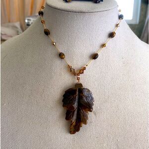 Dabby reid tiger eye faux stone Leif golden brownish crystal gold color chain